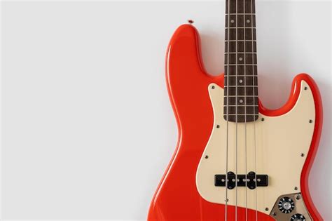 Premium Photo Red Bass Guitar On White Background Music Wallpaper