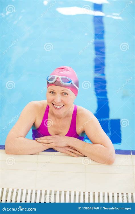 Happy Mature Woman Posing In Pool Stock Photo Image Of Retirement