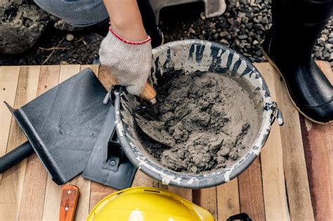 Premium Photo | Worker repair and fix cement fence at home. diy construction and renovate house.