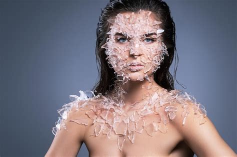 Premium Photo Portrait Of Woman With Broken Glass On Body Against Purple Background