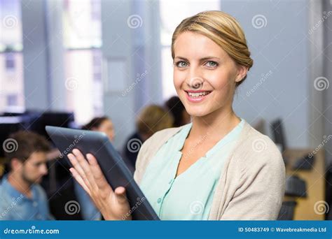 Female Teacher Using Digital Tablet In Computer Class Stock Image Image Of Focus Knowledge