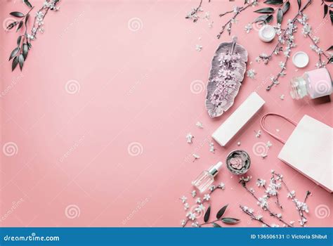 Cosmetic Concept Facial Skin Care Products And Paper Shopping Bag On Pastel Pink Background