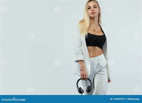 Beautiful Blonde Dj Woman On White Background In Studio Wearing