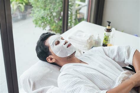 Men Skincare And Facial Face Care With Facial Mask In Spa Salon Stock