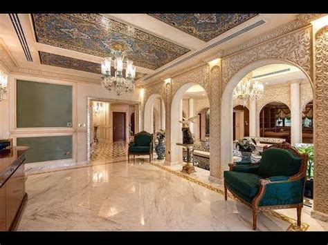 An Ornately Decorated Living Room With Chandelier