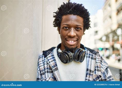 Handsome Black Man With Afro Hair Wearing Headphones Smiling Happy