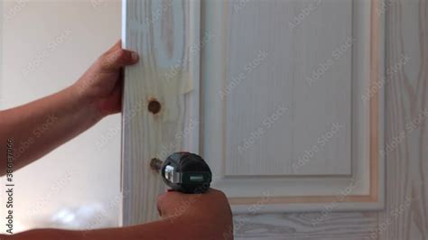 Repair Of Locks And Its Devices In A Wooden Door Stock Adobe Stock