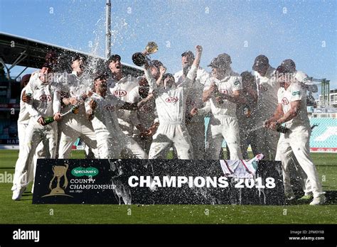 Surrey Players Celebrate With The Championship Trophy During Surrey Ccc