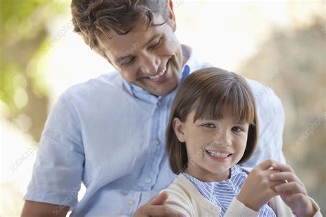 Father And Daughter Hugging Outdoors Stock Image F013 9389