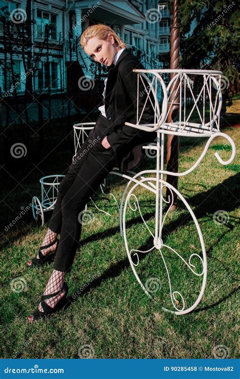 Portrait Of Stylish Fashionable Beautiful Blonde Woman In Man Black