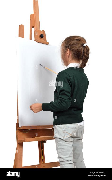 Little Girl Is Painting On Easel Stock Photo Alamy