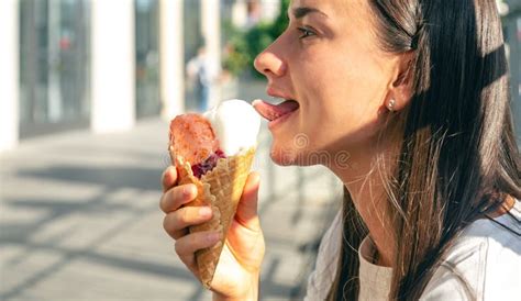 Portrait Of Happy Caucasian Brunette Woman Eating Ice Cream Cone Stock Photo Image Of Happy