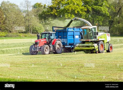 Farmer Collecting Grass For Silage In The Cheshire Countryside Farmland