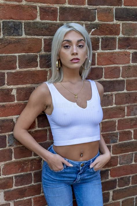 A Lovely Blonde Model Poses Outdoors In A Large City Environment Stock Image Image Of