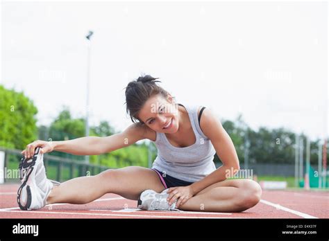 Brunette Stretching Her Legs Stock Photo Alamy