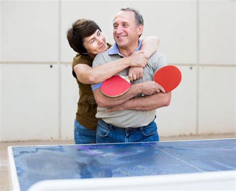 A Couple Of People Playing Table Tennis Stock Image Image Of