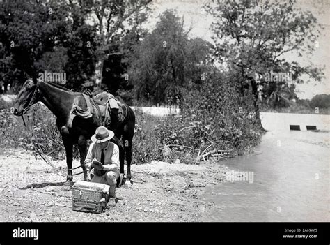 Pigeon Section, Signal Corps. Writing a message preparatory to ...