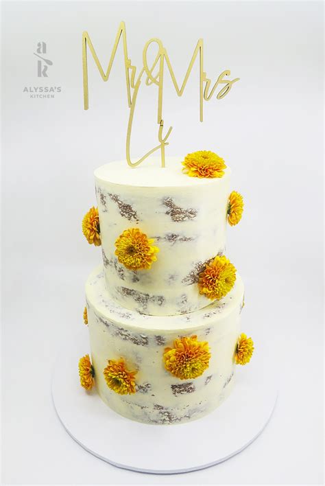 Double Height Carrot Semi Naked Cake With Flowers Alyssas Kitchen Custom Made Cakes Desserts