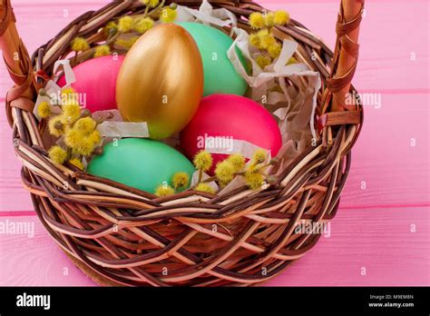 Easter Eggs And Pussy Willow In Woven Basket Gold Egg And Colorful Eggs Decorated With Pussy