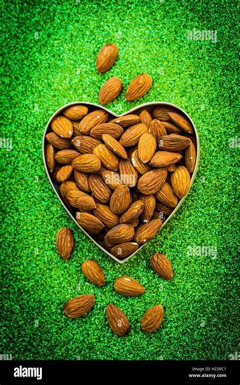 Almonds in heart shape Stock Photo - Alamy