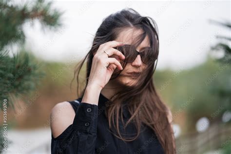 Beautiful Woman With Brunette Hair In Dark Clothes And Sunglasses Fashion Street Photography