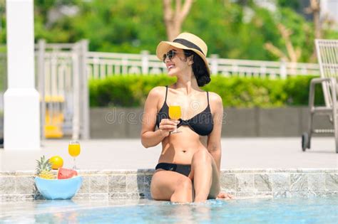 Happy Smiling Woman In Bikini With Straw Hat Relaxing With Orange Juice