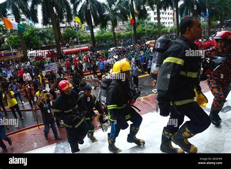 Bangladeshi Firefighters Work To Douse A Fire At The Bashundhara City
