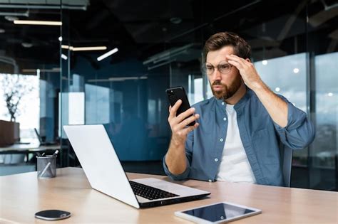 Premium Photo Serious Mature Boss Working Inside Modern Office