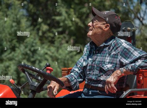 Farmer Sitting On A Tractor Hi Res Stock Photography And Images Alamy