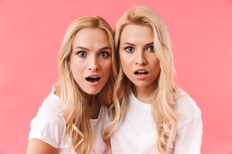 Premium Photo Surprised Blonde Twins Wearing In T Shirts Looking At