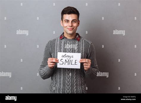 Smiling Brunette Man In Sweater Holding Nameplate Always Smile And