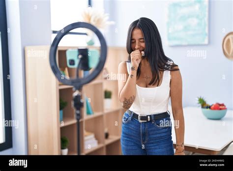 Brunette Woman Recording Vlog Tutorial With Smartphone At Home Feeling Unwell And Coughing As