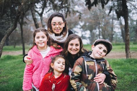 Premium Photo Same Sex Parents With Their Son And Daughters Laughing Hugging In The Park Lgbt