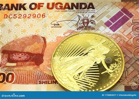 A Thousand Shilling Note From Uganda With A Gold Coin In Macro Stock