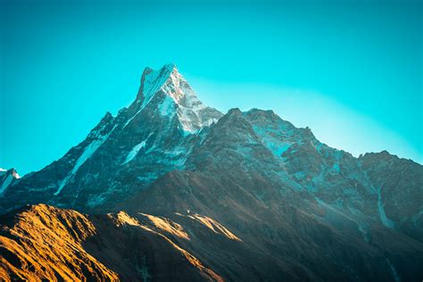 Gray Rocky Mountain Under Blue Sky During Daytime Photo Free
