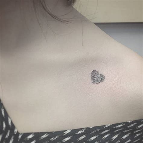 Tiny Heart Tattoo On The Collarbone