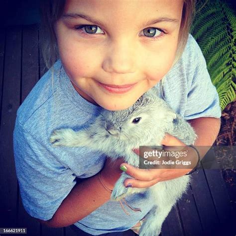 Child Holding Bunny Photos And Premium High Res Pictures Getty Images