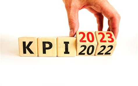 Kpi Key Performance Indicator Symbol Businessman Turns Wooden Cubes