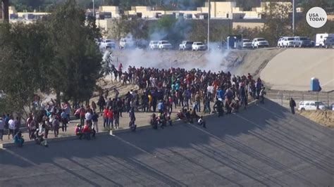 Border agents fire tear gas as migrants try to breach U.S.-Mexico border