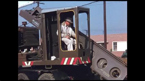 1950s Man Operates Excavator Truck Crane Scoops More Dirt And Mud Out