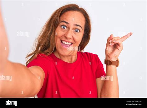 Middle Age Mature Woman Taking A Selfie Photo Using Smartphone Over