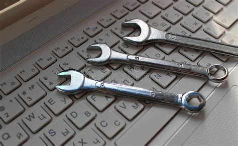 Steel Spanners On White Laptop Bilingual Keyboard Stock Image Image