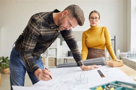 Premium Photo Side View Portrait Of Mature Bearded Architect Drawing