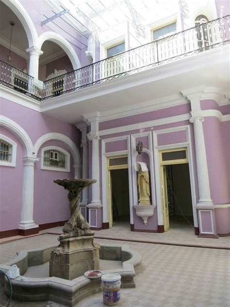 The Inside Of A Building With A Fountain