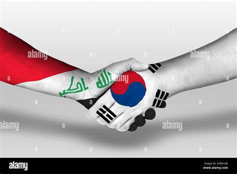 Handshake Between South Korea And Iraq Flags Painted On Hands