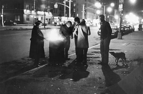 A Group Of Homeless Men Stand Around A Fire In An Oil Drum On The Homeless Man Homeless