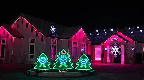 Three Smiling Christmas Trees Sing Modern Carols In A Fantastic Holiday