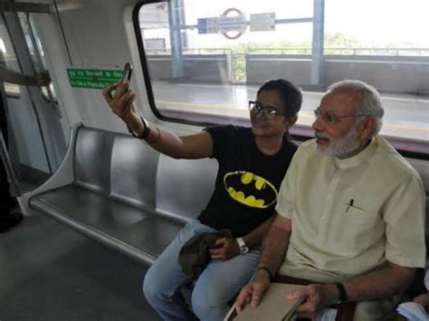 In Pics Pm Modi Travels In Delhi Metro Interacts With Commuters Oneindia News