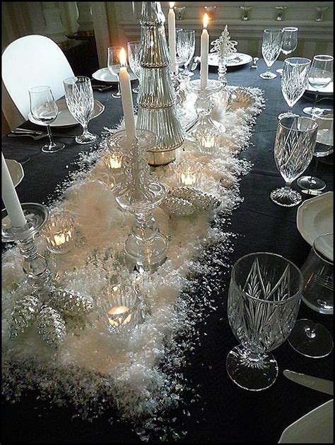 The Table Is Set With Candles And Glassware For An Elegant Dinner Or