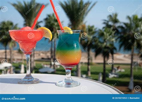 Colourful Cold Strawberry Daiquiri And Rainbow Paradise Cocktails